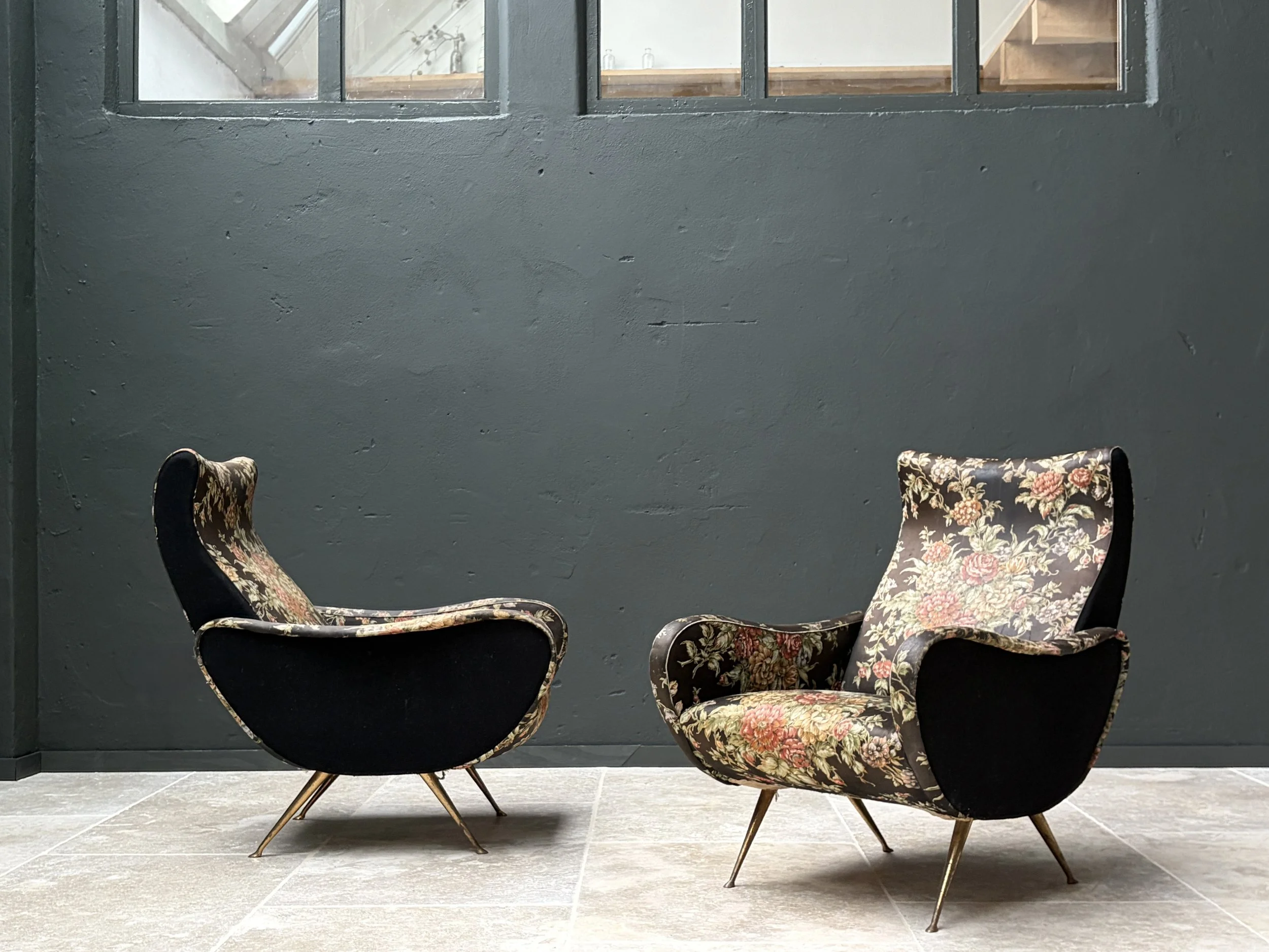 Pair of 1950s Italian armchairs by ISA Bergamo with brass legs and floral fabric