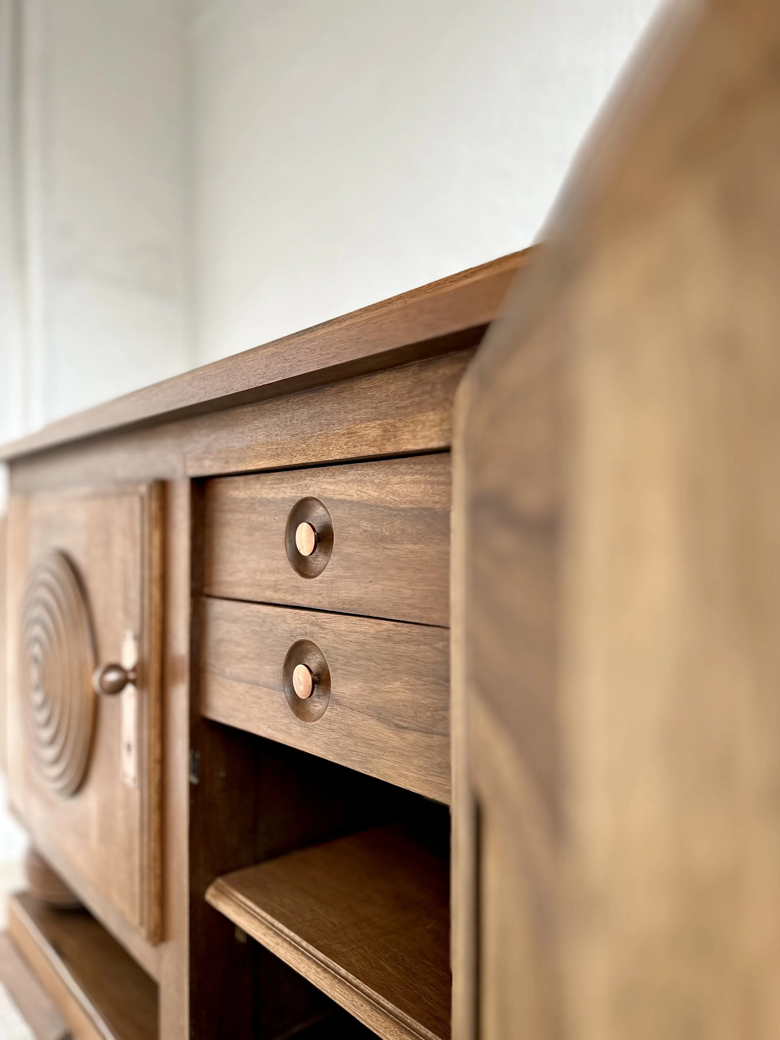 Charles Dudouyt Art Deco solid oak cabinet with geometric carvings and copper hardware, France