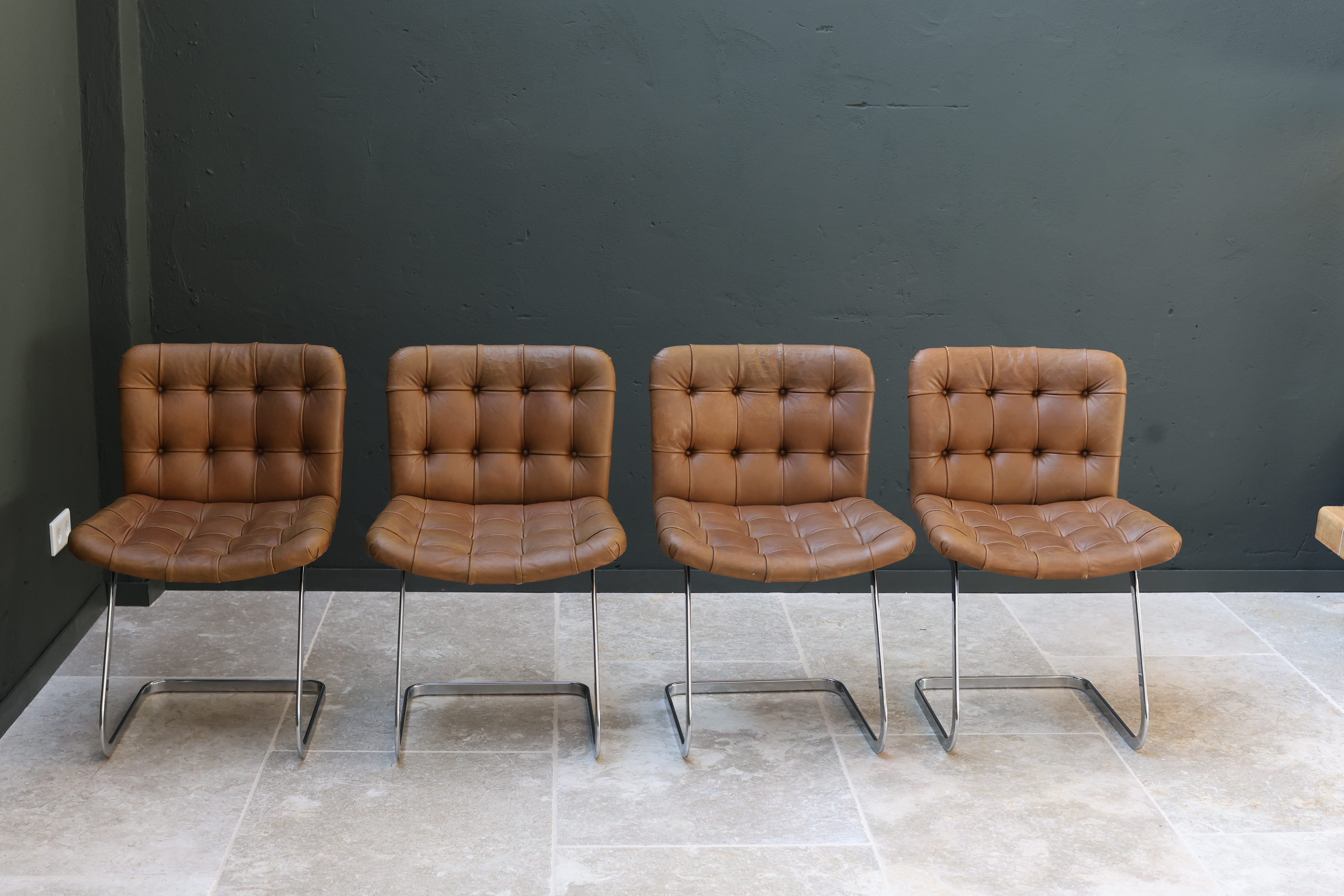 Set of four De Sede RH-304 'UNESCO' dining chairs in tufted cognac leather on chrome cantilever frames, Robert Haussmann