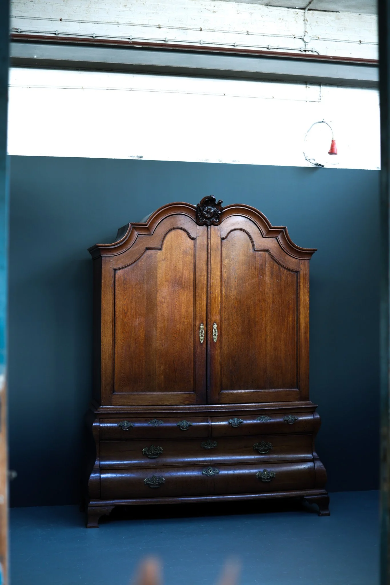Dutch Rococo bombe cabinet in solid oak with curved silhouette, 18th century, circa 1775-1800