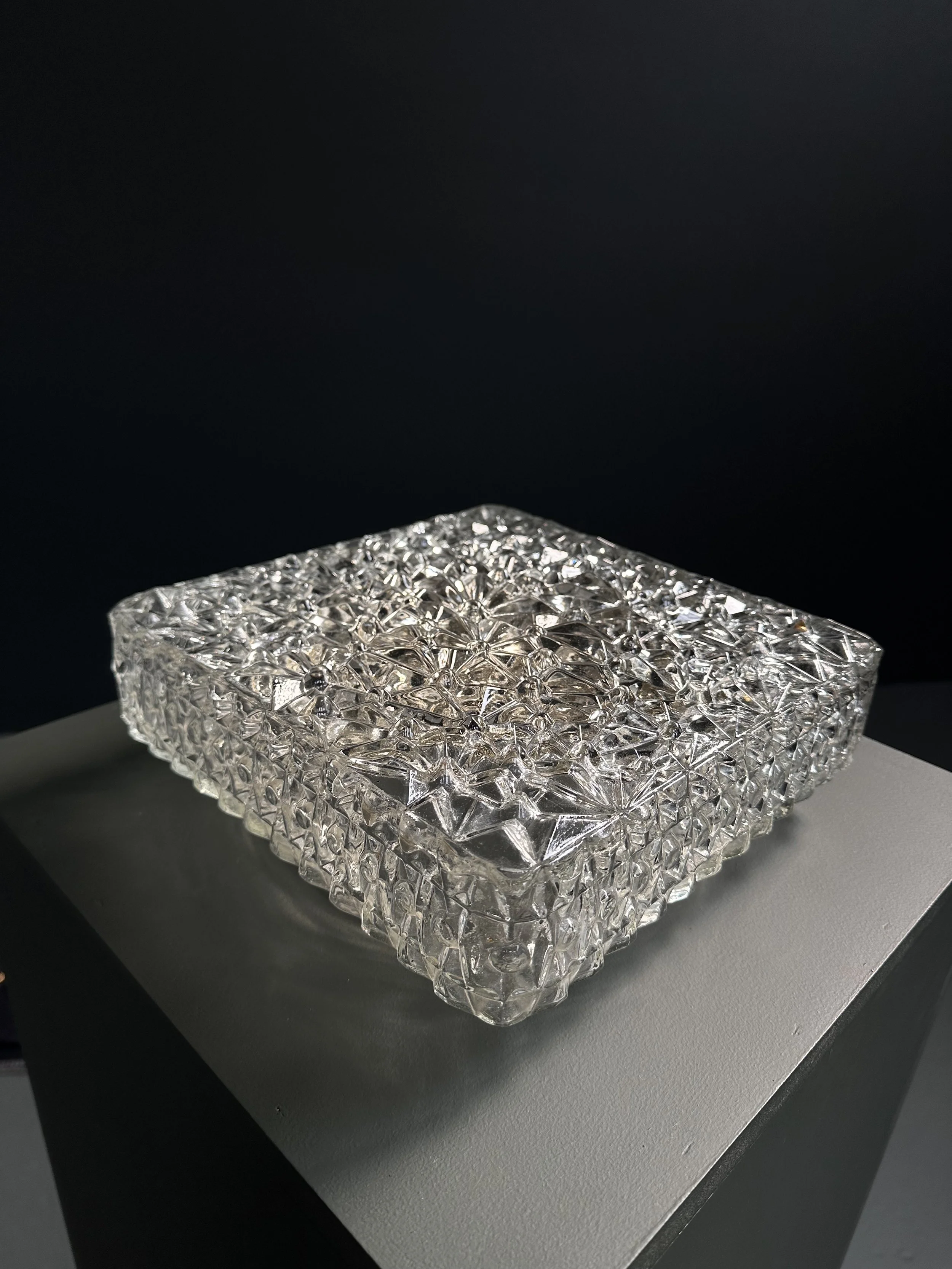 Pair of Fram crystal glass ceiling lights with textured floral pattern, Swiss, 1970s