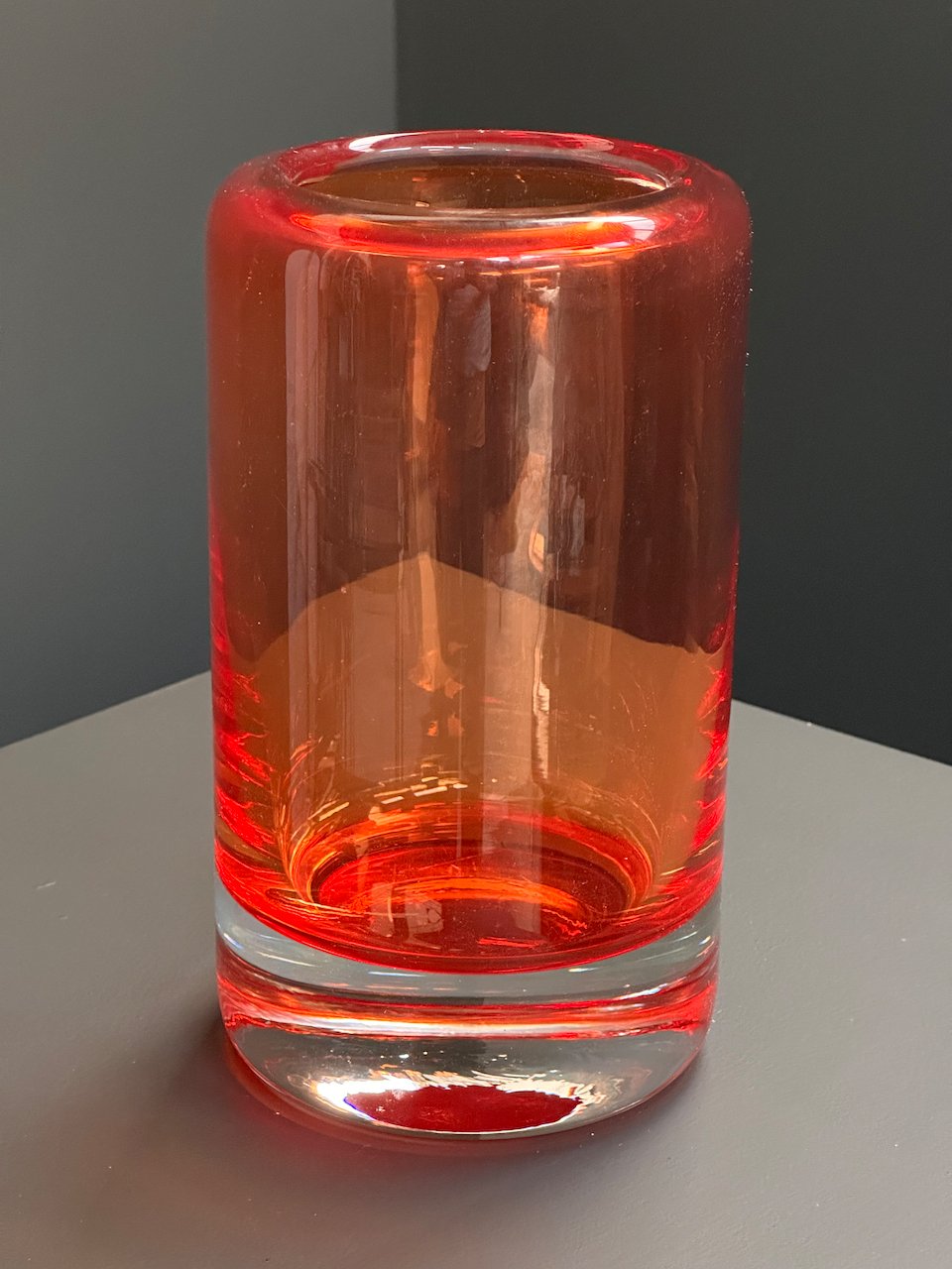 Günther Lambert cylindrical red glass vase with thick clear base, signed, Germany
