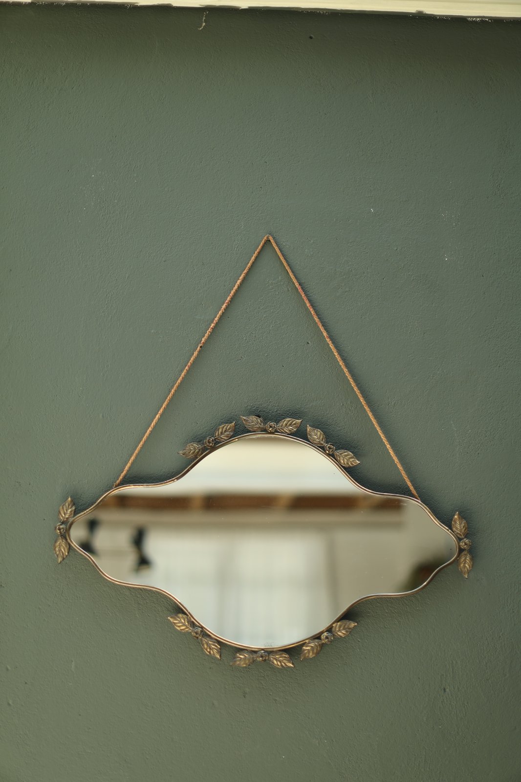 Vintage Italian wavy wall mirror with wrought-metal frame of roses and leaves, Florentine style