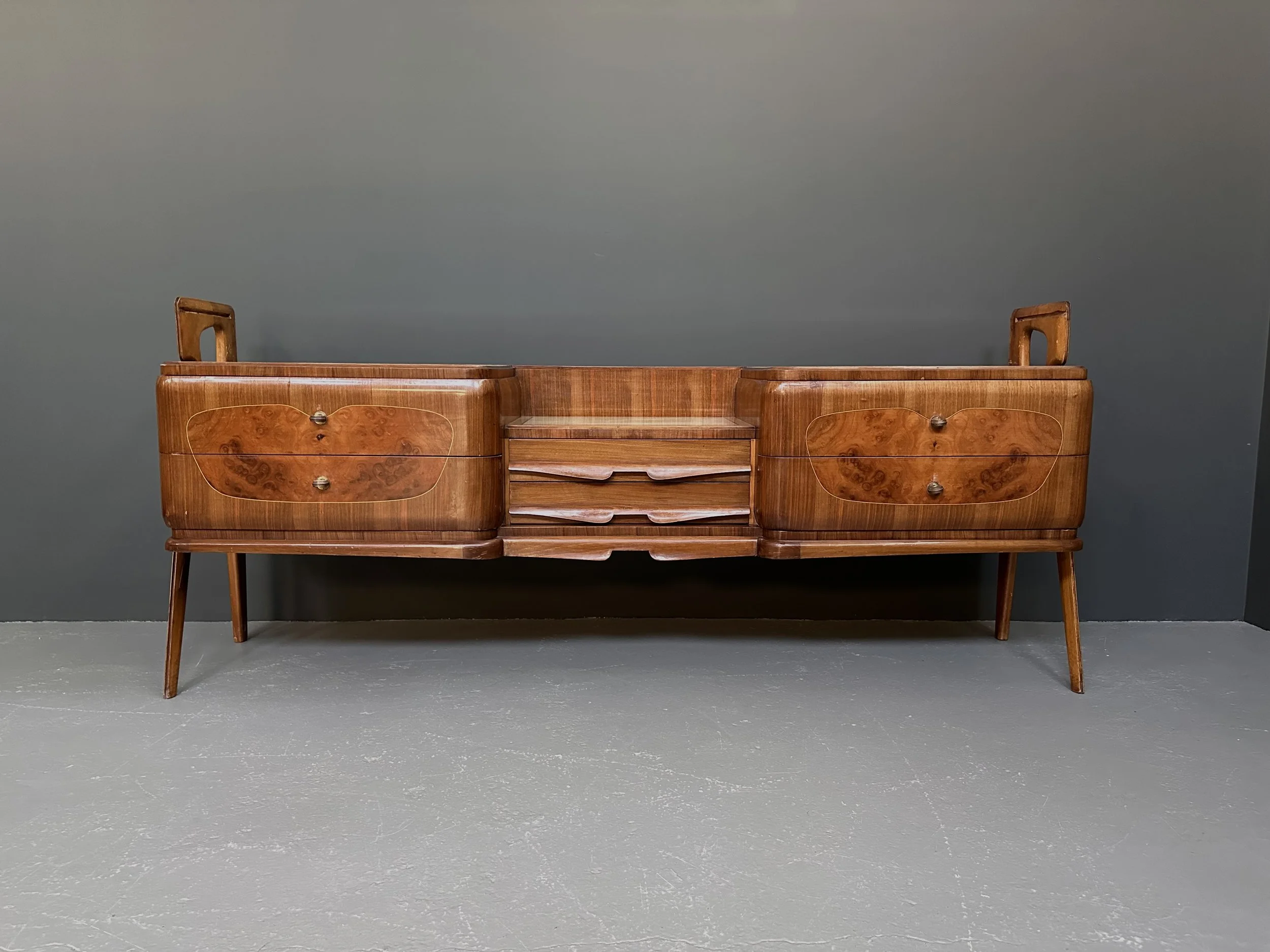Italian mid-century walnut burl sideboard with wave-shaped drawers and tapered legs 1959