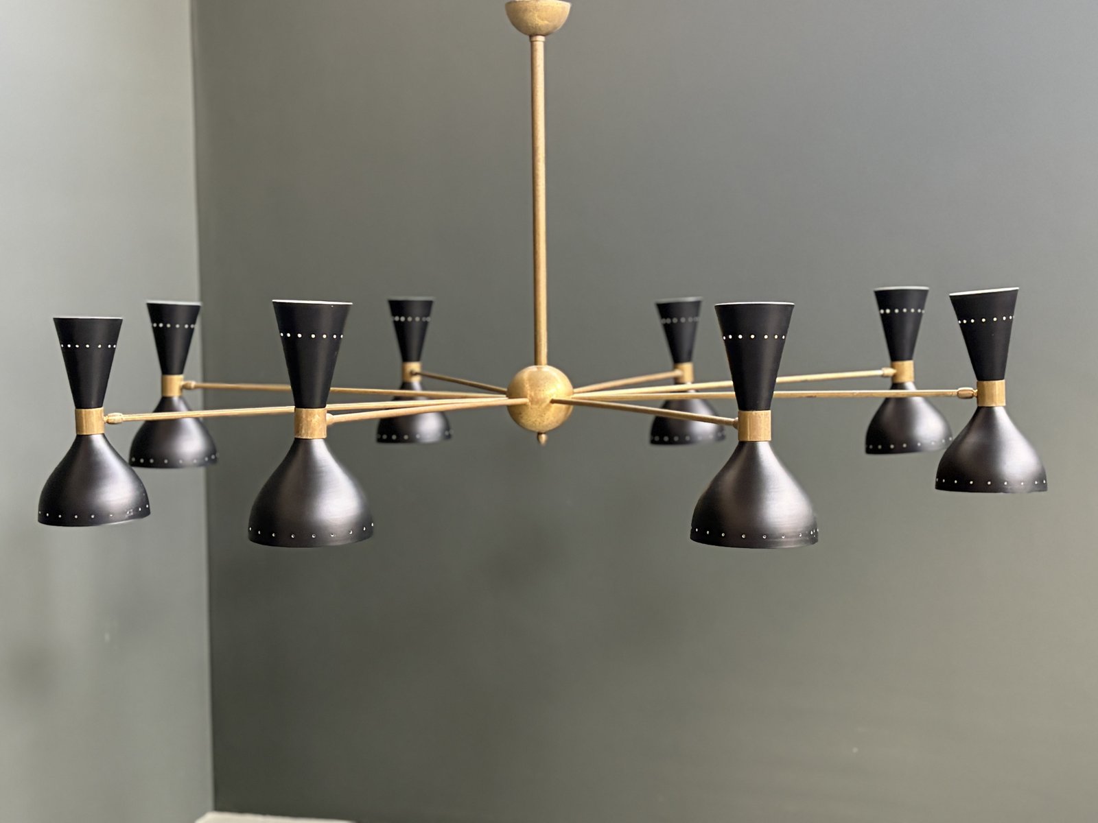 Italian eight-arm Stilnovo-style chandelier with black diabolo shades and brass arms