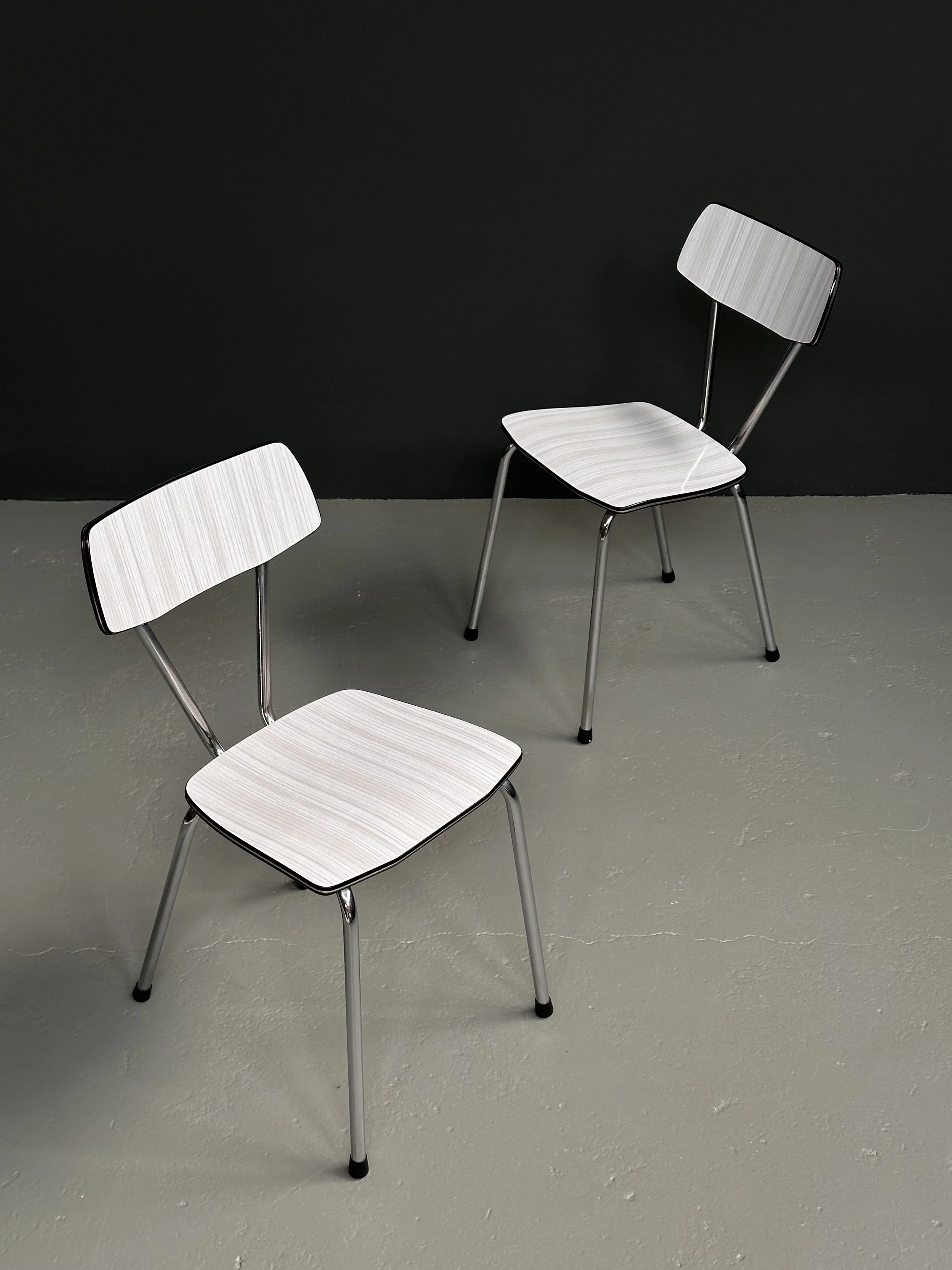 Italian 1960s Formica and chromed metal kitchen chairs in white with slim curved legs