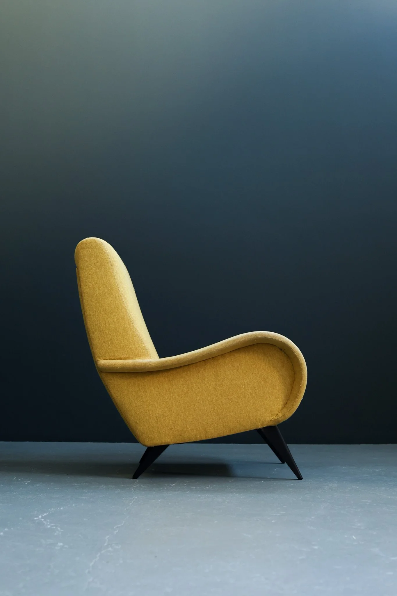 Mid-century Italian armchair in the style of Marco Zanuso with fabric upholstery and curved form