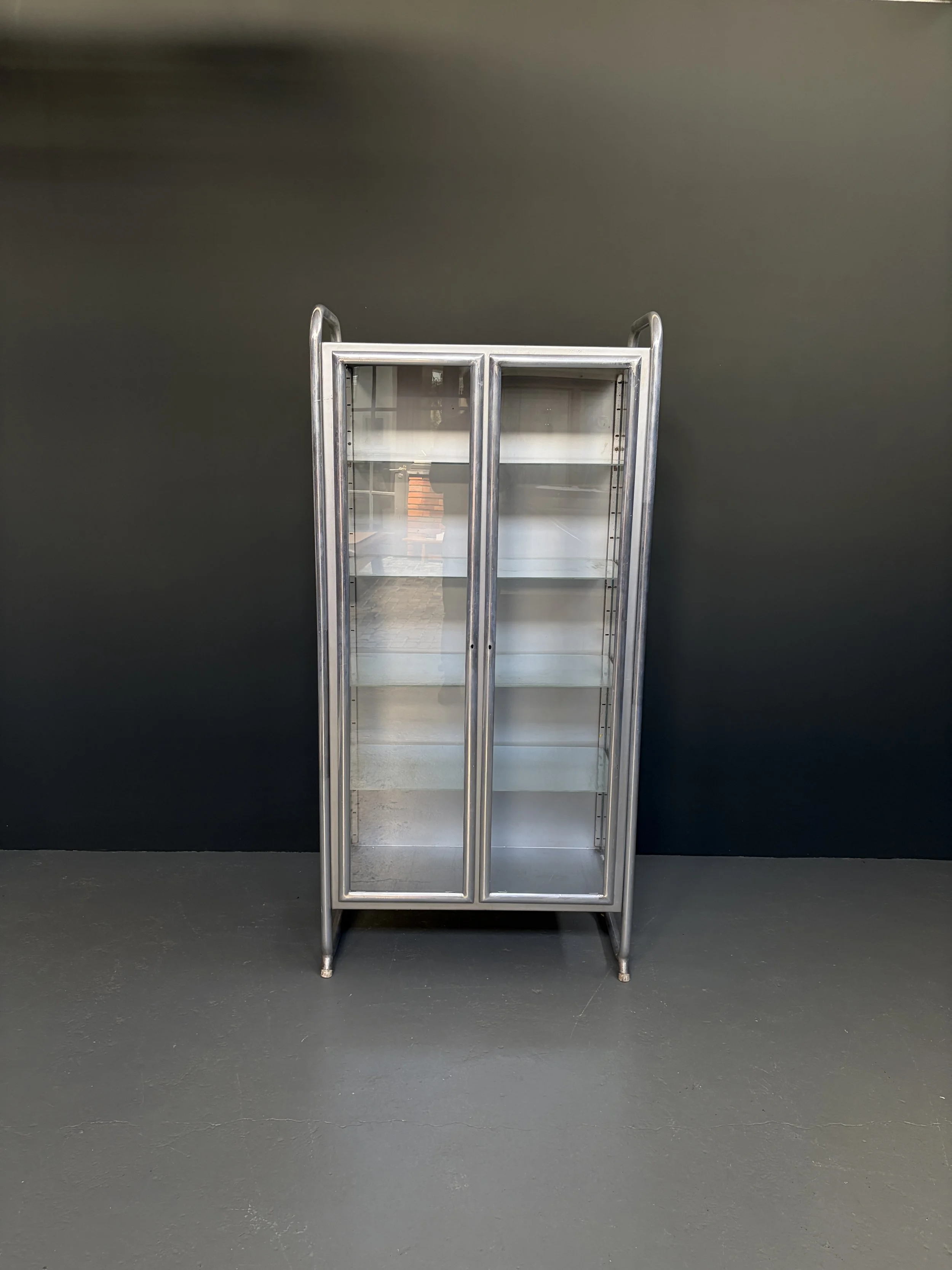 Italian P.R.O.F.A. medical display cabinet in brushed aluminum with ribbed glass doors, Padua, 1960s