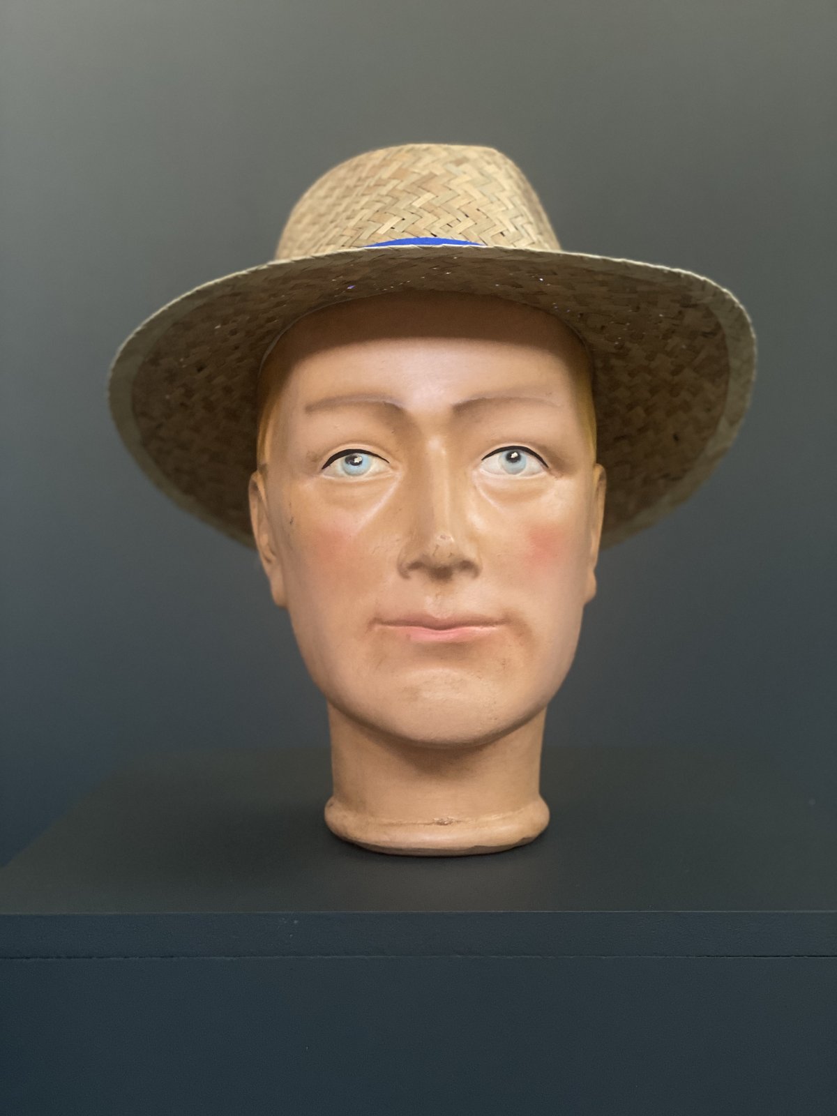 Vintage 1950s hand-painted plaster mannequin head with blue eyes and blonde hair from a German shop display